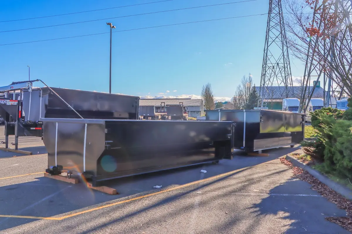 Roll-off dumpster ready for waste disposal at job site for 2 Yard Dumpster Rental in Minden
